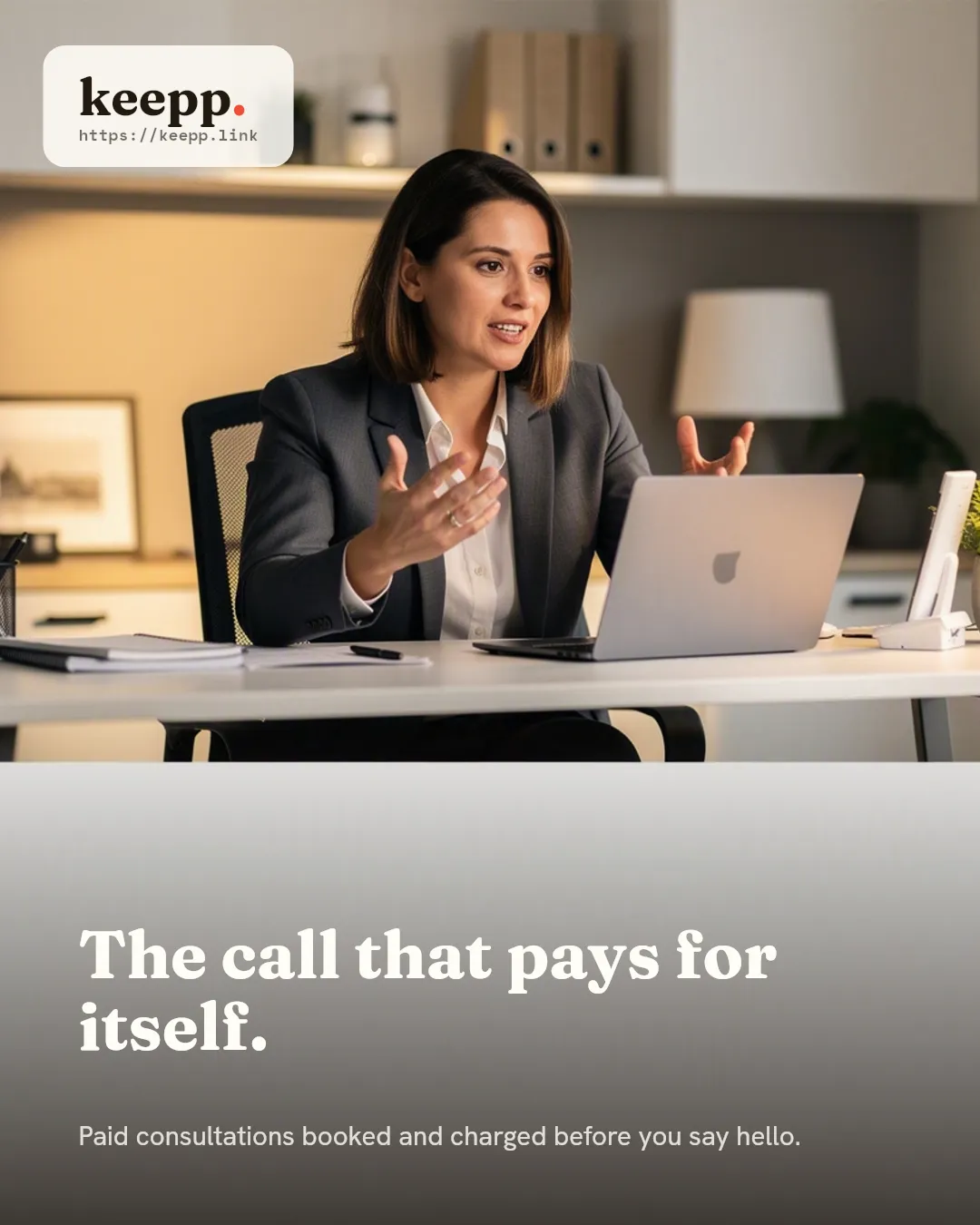 A consultant on a video call at his desk, gesturing naturally mid-conversation